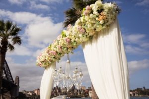 professional photo of wedding ceremony under sydney harbour bridge