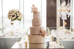 professional photo of bride at wedding cake sydney